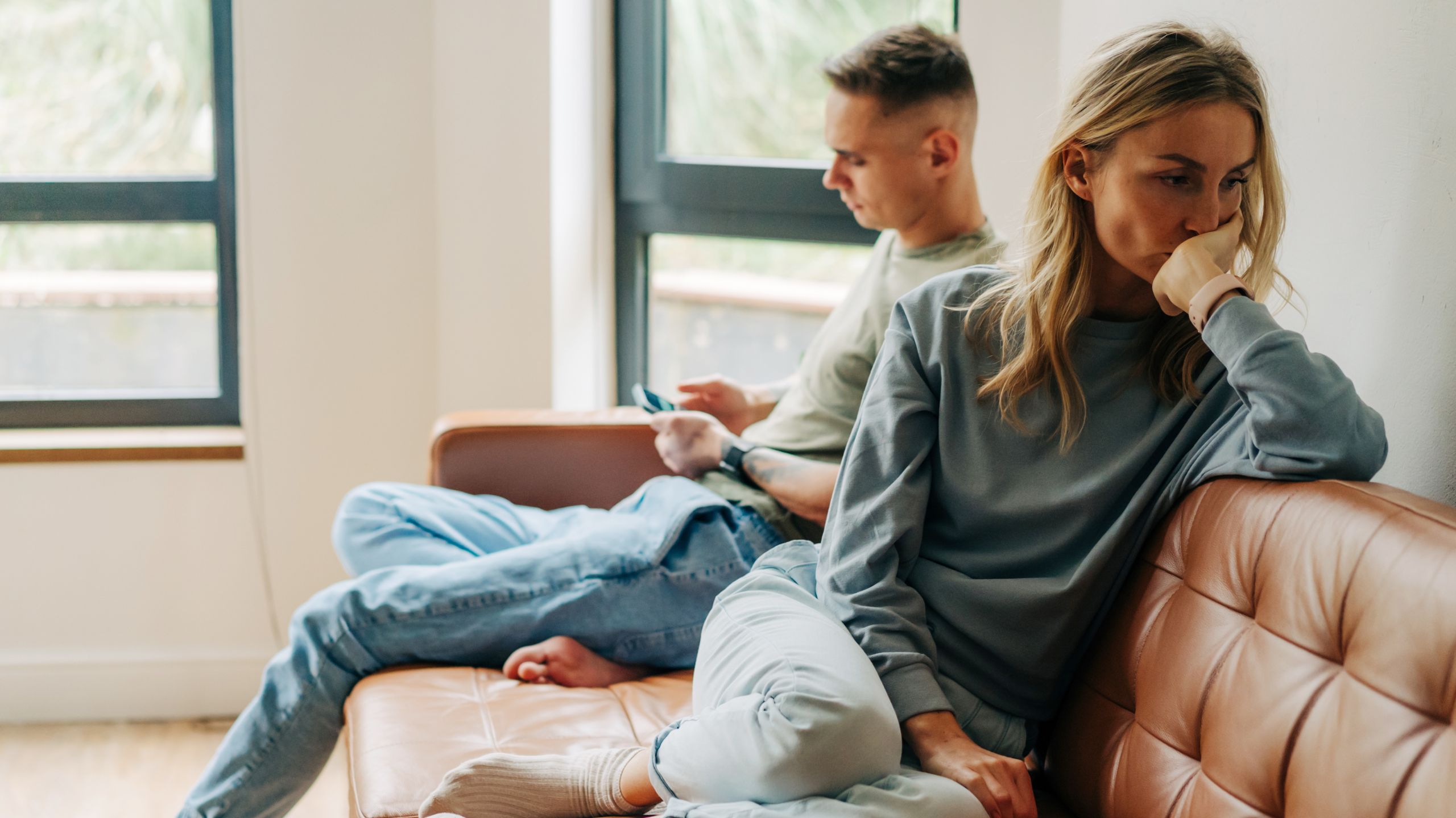 People in a group, holding hands in support
